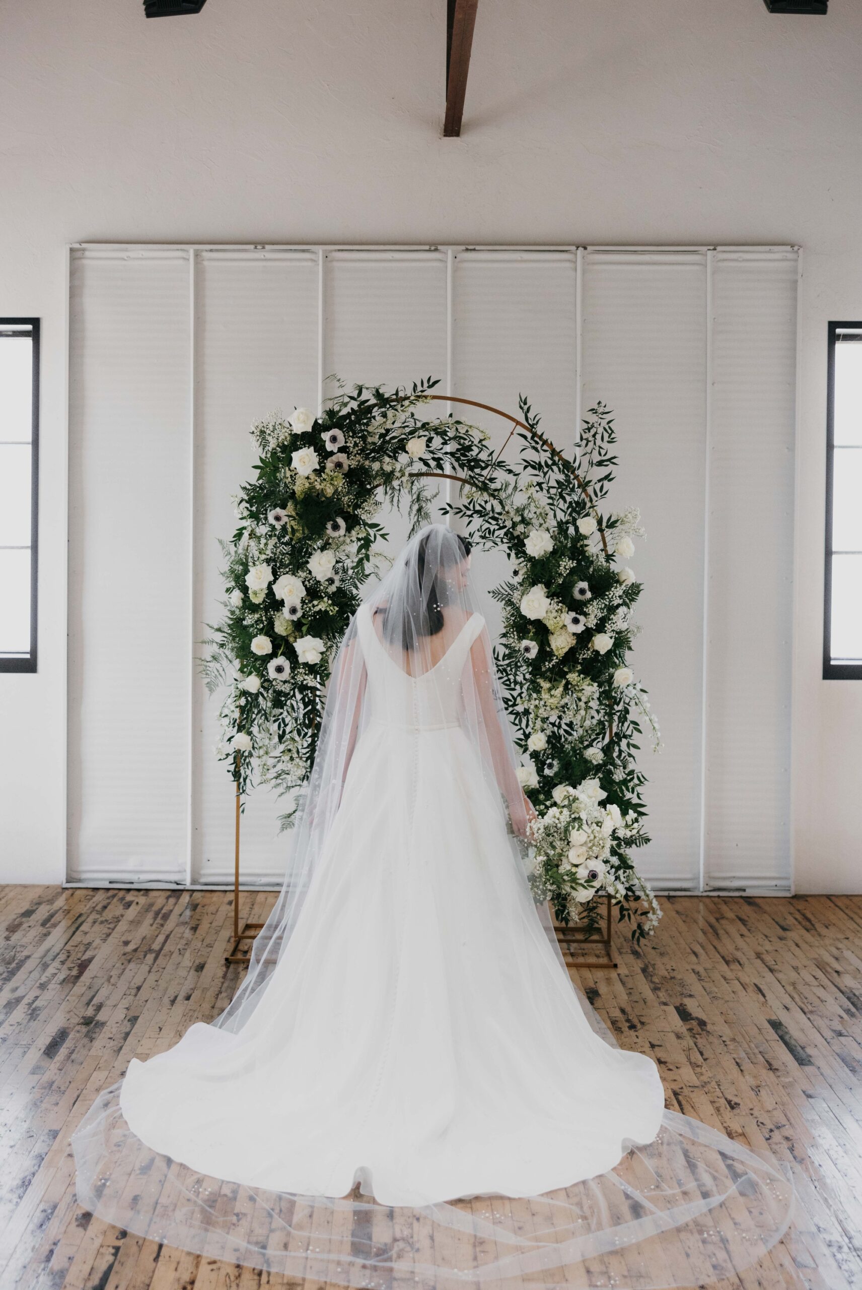 Bride in front of arch